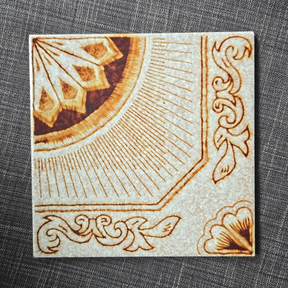 Vintage Ceramic Tile with Ornate Design
